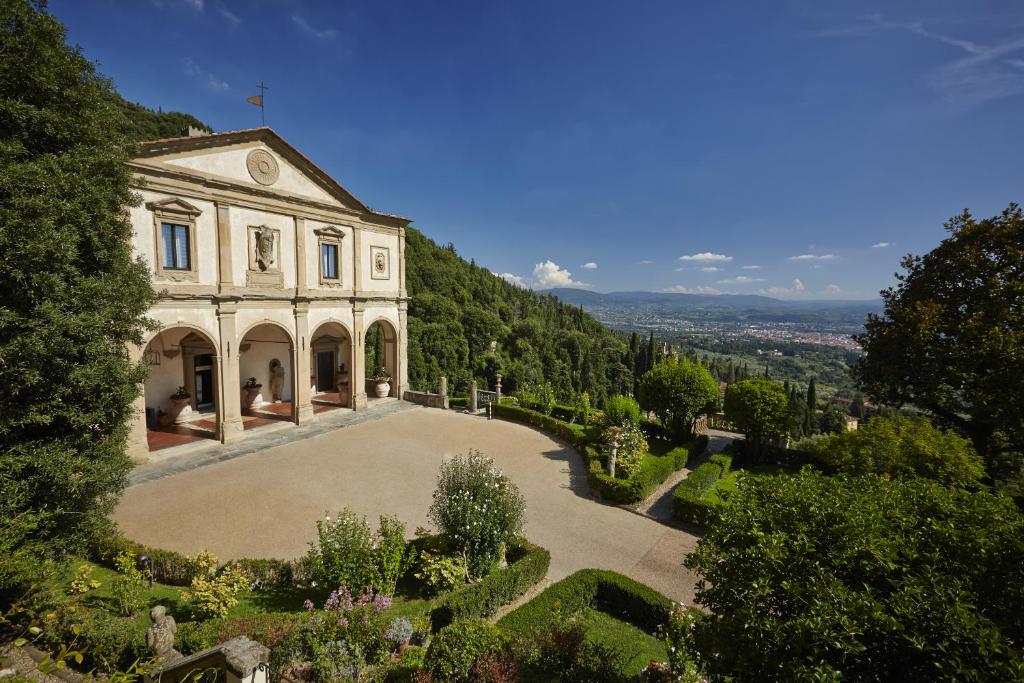 Offering panoramic views of Florence, Villa San Michele, A Belmond Hotel, Florence is a former monastery nestled on a hilltop amid lush trees and terraced...