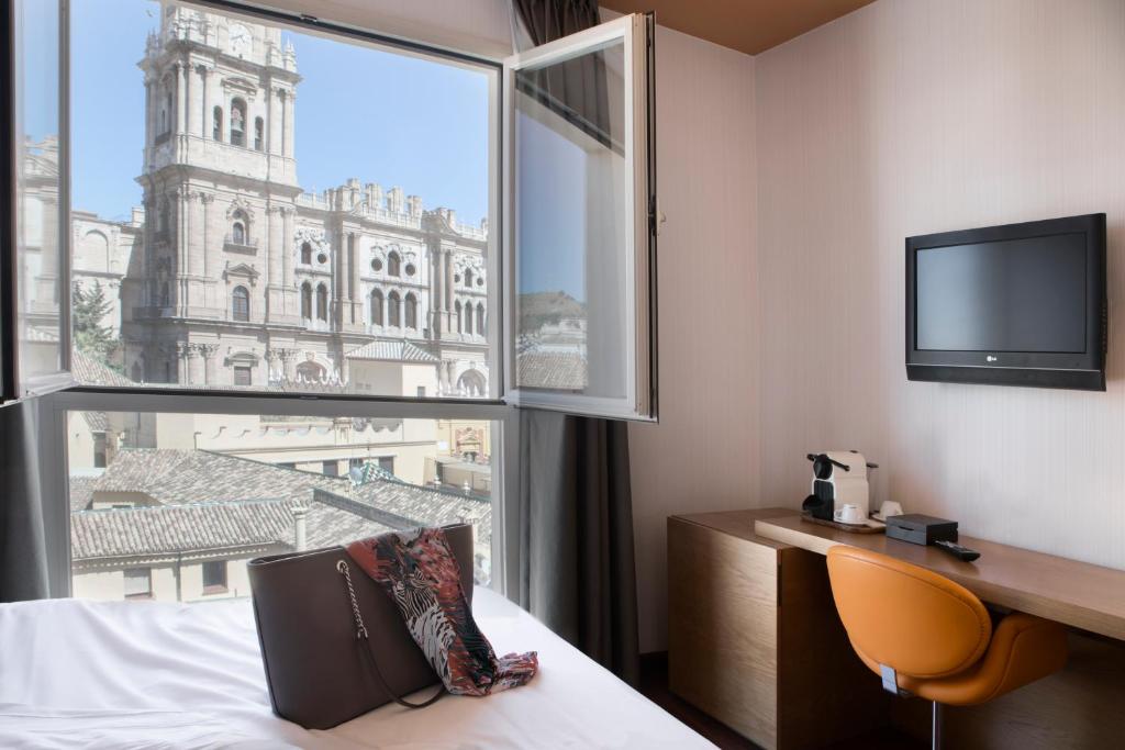 Located on a pedestrian area just off the popular Larios Street, next to Carmen Thyssen Museum and opposite Málaga Cathedral, this design hotel features...