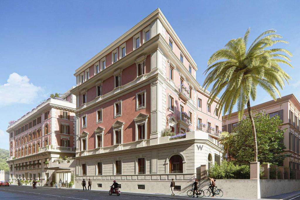 W Roma tiene bicicletas gratuitas, gimnasio, jardín y terraza en Roma. Este hotel de 5 estrellas ofrece servicio de habitaciones y recepción 24 horas.