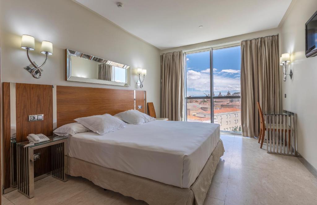 Free Wi-Fi and flat-screen cable TV are included in each spacious room at this modern hotel.