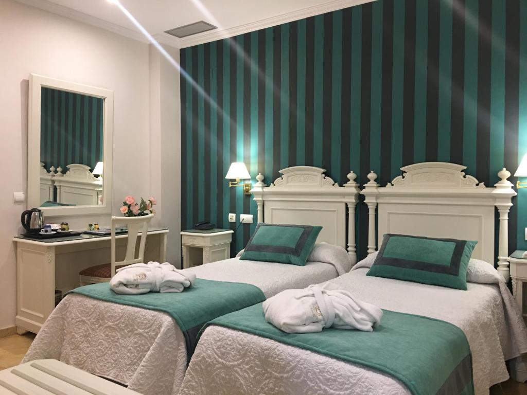 Situato in un edificio settecentesco nel centro di Siviglia, a soli 250 metri dalla Cattedrale e dalla Giralda, questo hotel boutique offre la connessione WiFi gratuita.
