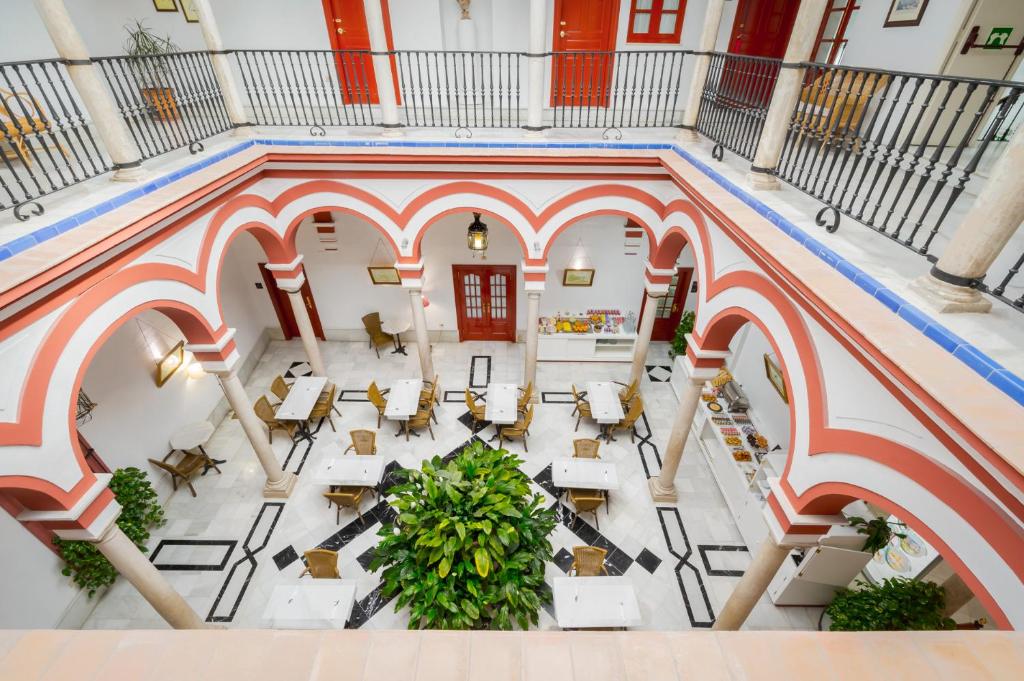 This hotel is located in an 18th-century house in Seville’s old trading centre, within 300 metres of the Cathedral and Giralda Tower.